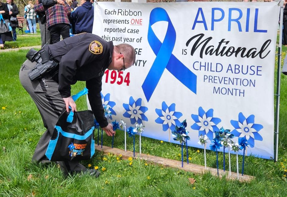 Community members, first responders and members of the Child Protection Center of Ross County commemorated Child Abuse Prevention Month with a display at the entrance of Yoctangee Park.