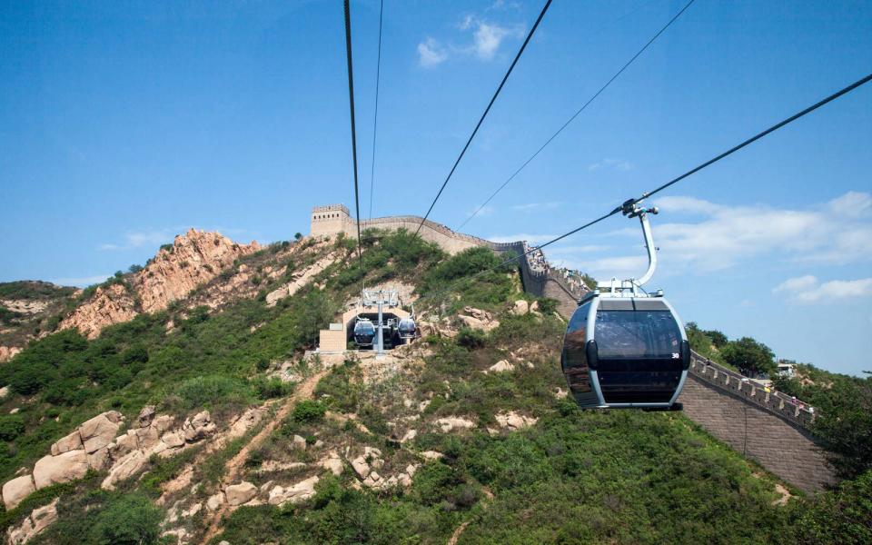 <p>The beautiful, Ming Dynasty portion of the Great Wall is just 70 miles from Beijing. But getting there can be a bit tricky for travelers making the trek solo.</p> <p>Visitors sticking with public transportation will first need to get to Dongzhimen Station, where you can take an hour-long express bus ride to Huairou Station. Here, you’ll need to transfer to a bus stopping at the Mutianyu Roundabout.</p> <p>Subway lines also transfer to Dongzhimen Station from the Beijing West Railway Station, Beijing South Railway Station, and the Beijing Railway Station. The Airport Express connects directly from the Capital International Airport to Dongzhimen Station.</p> <p>Most experts on travel to the Great Wall will recommend skipping the train and opting for a hired car and a guide. They’ll be able to take you to less popular sections of the wall and can help navigate unexpected hiccups, such as road closures. A car is also the best way to maximize your time.</p> <p>This could, however, be quickly changing. By 2019 — in time for the Winter Olympics in 2022 — China plans to open <a rel="nofollow noopener" href="http://www.travelandleisure.com/travel-tips/ground-transportation/china-building-worlds-deepest-railway-station-under-great-wall" target="_blank" data-ylk="slk:the world’s deepest, largest high-speed railway station;elm:context_link;itc:0;sec:content-canvas" class="link ">the world’s deepest, largest high-speed railway station</a> beneath the Great Wall’s Badaling section.</p>