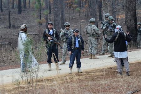 Soldiers from 1st Brigade Combat Team, 10th Mountain Division play the role of the Afghan National Army as part of the 1st Security Force Assistance Brigade Joint Readiness Training Center rotation at Fort Polk, Louisiana, U.S., January 21, 2018. Picture taken January 21, 2018. Sgt. Joseph Truckley, 50th Public Affairs Detachment, 3rd Infantry Division/U.S. Army/Handout via REUTERS