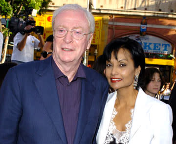 Premiere: Michael Caine with wife Shakira at the Hollywood premiere of Warner Bros. Pictures' Batman Begins - 6/6/2005 Photo: Steve Granitz, WireImage.com