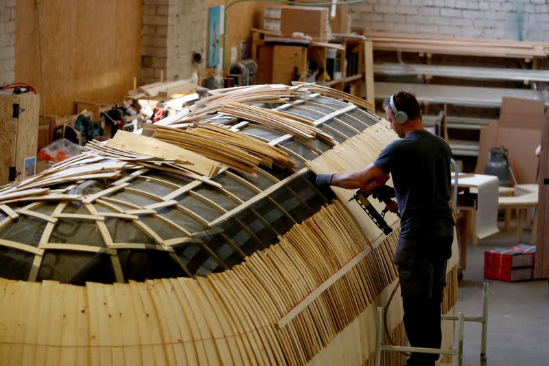 Iglucraft comapany worker makes a roof of the Iglusaun sauna in Leie