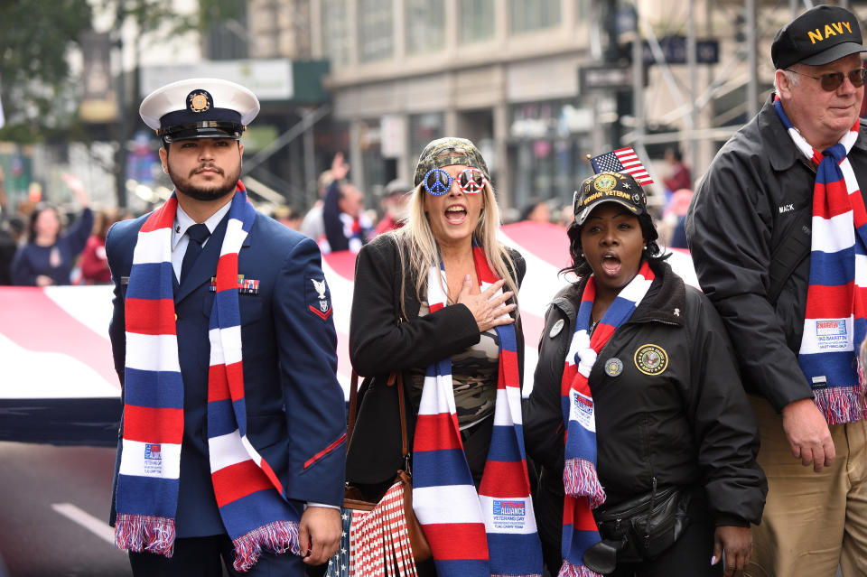 NEW YORK, NEW YORK - NOVEMBER 11:   People watch the Veterans Day Parade on November 11, 2019 in New York City. President Donald Trump, the first sitting U.S. president to attend New York's parade, offered a tribute to veterans ahead of the 100th annual parade which draws thousands of vets and spectators from around the country.  (Photo by Kevin Mazur/Getty Images)