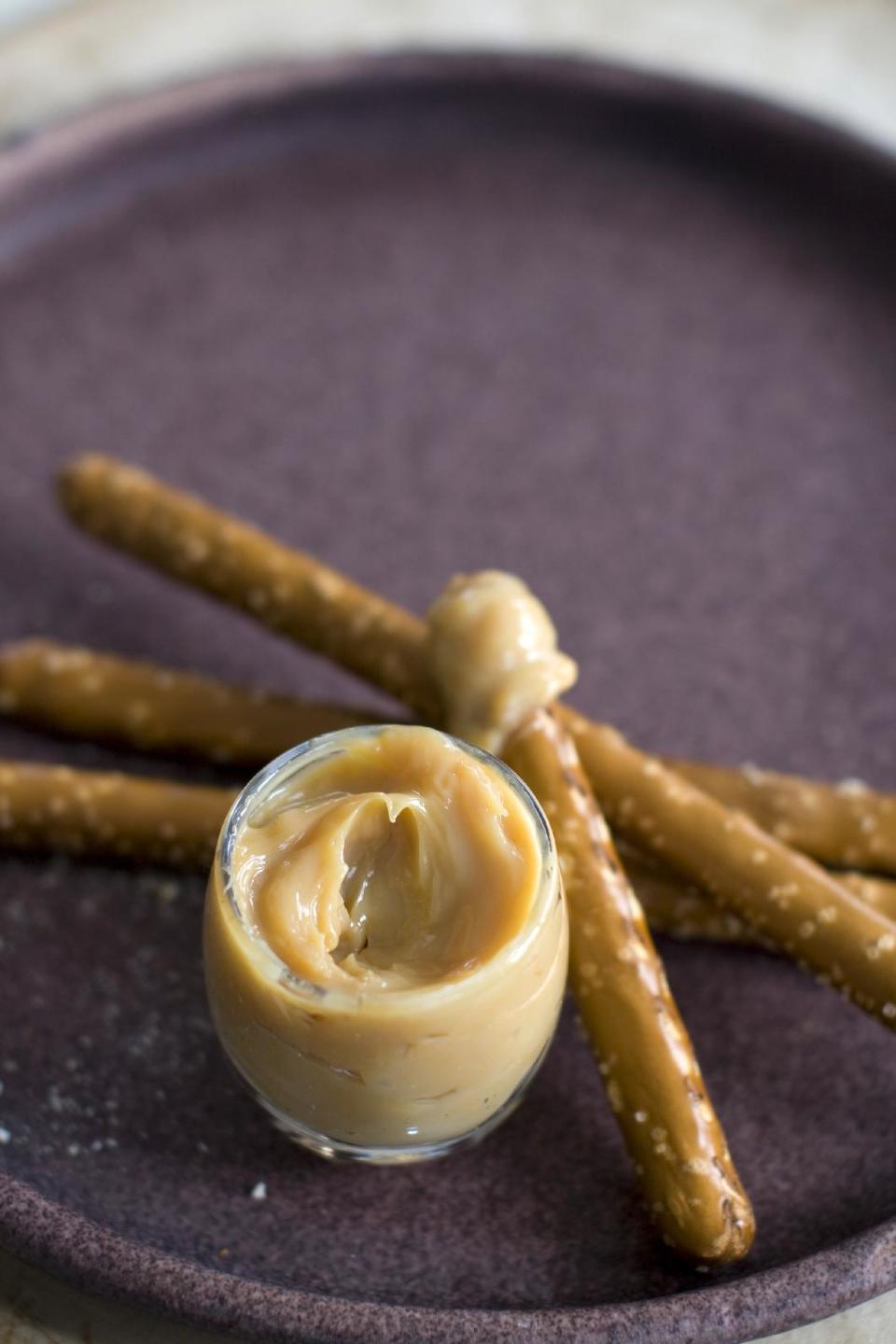 This April 1, 2013 photo taken in Concord, N.H. shows pretzel sticks with a dulce de leche spread. (AP Photo/Matthew Mead)