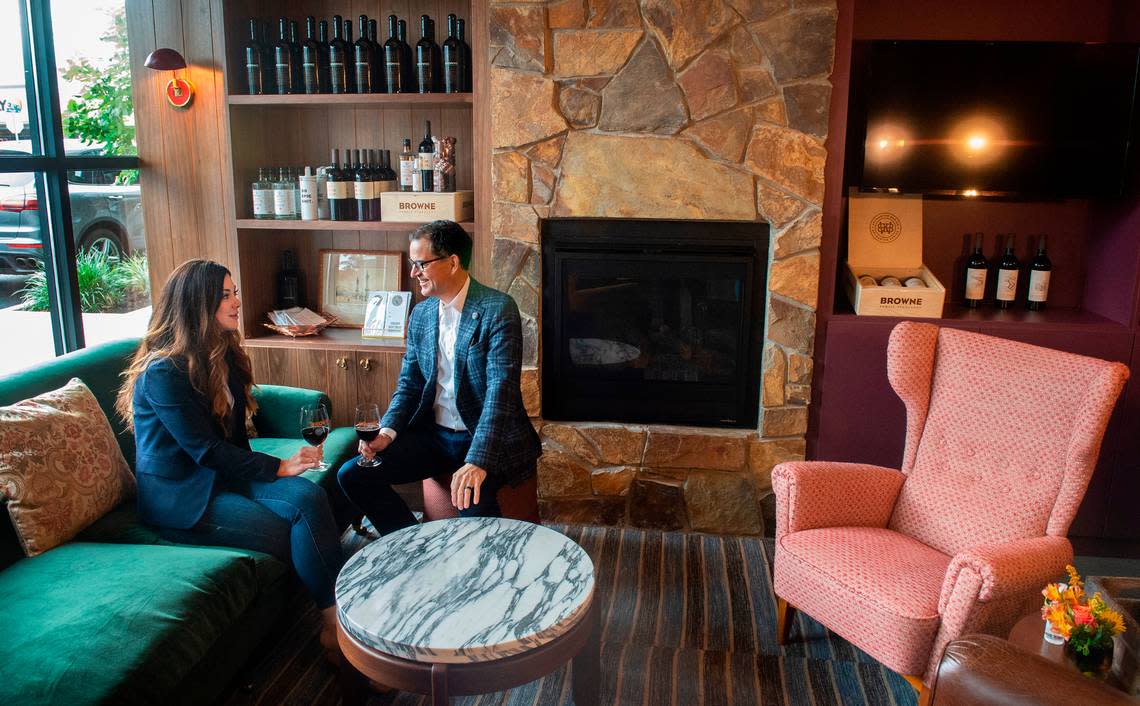 Owners Courtney and Andrew Browne relax in their well-appointed Brown Family Vineyards tasting room in Tacoma’s Proctor District, which opened in 2020.