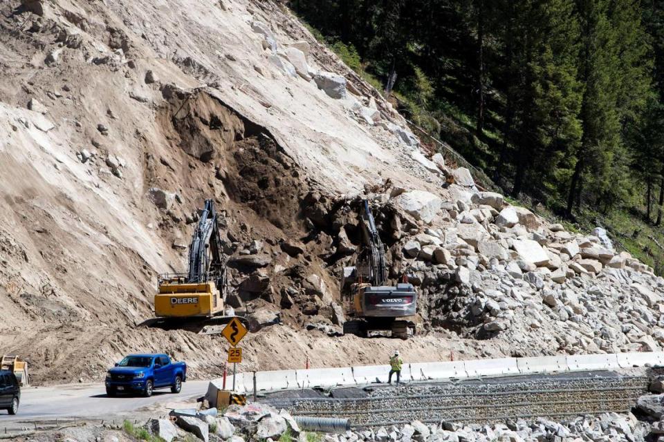 Crews worked to remove rock and debris from one of nine hillsides along the Idaho 55 highway project north of Smiths Ferry. Construction began in fall 2020 to widen and straighten the mile-long stretch of road for safer travel along the Payette River.