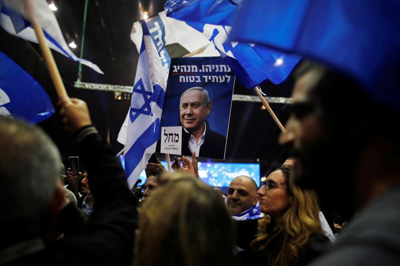 Supporters react as results of the exit polls in Israel's elections are announced at Israeli Prime Minister Benjamin Netanyahu's Likud party headquarters in Tel Aviv
