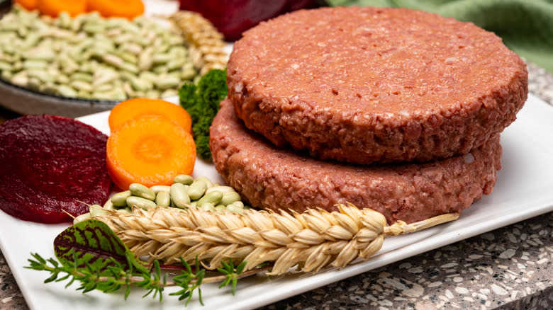 Uncooked plant-based patties with grains and veggies