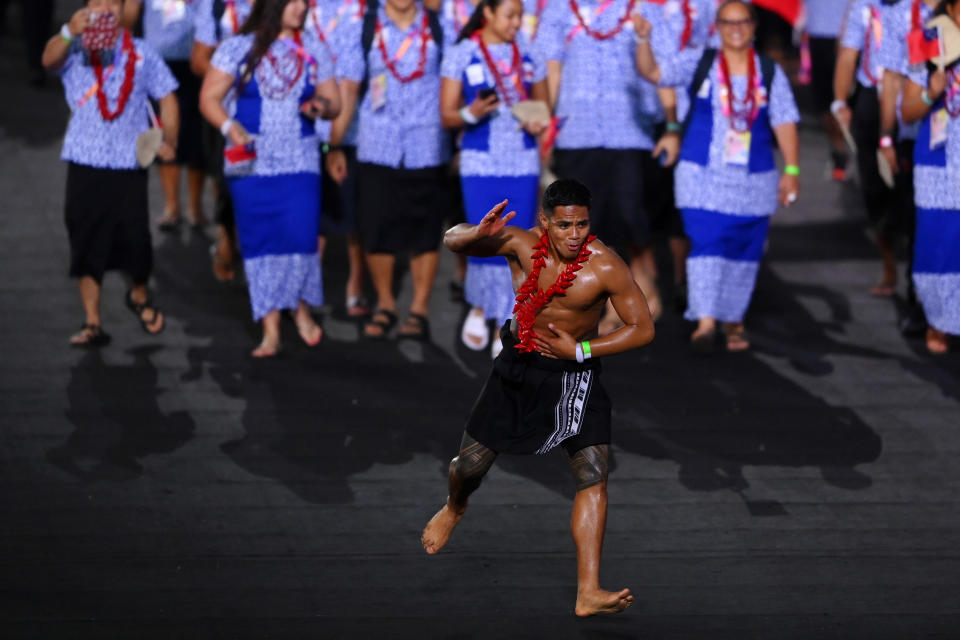 An athlete of Team Samoa, pictured here walking around the stadium during the opening ceremony of the Commonwealth Games.