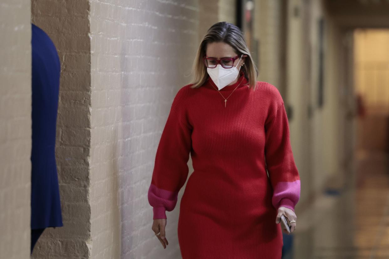 Sen. Kyrsten Sinema (D-AZ) walks to her office in the basement of the U.S. Capitol Building on January 19, 2022 in Washington, DC.