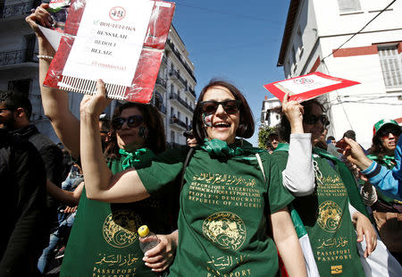 Women wearing t-shirts depicting the Algerian passport take part in a protest to demand political change and the departure of the ruling elite, as Algeria prepares for a presidential election in July, in Algiers, Algeria April 12, 2019. REUTERS/Ramzi Boudina