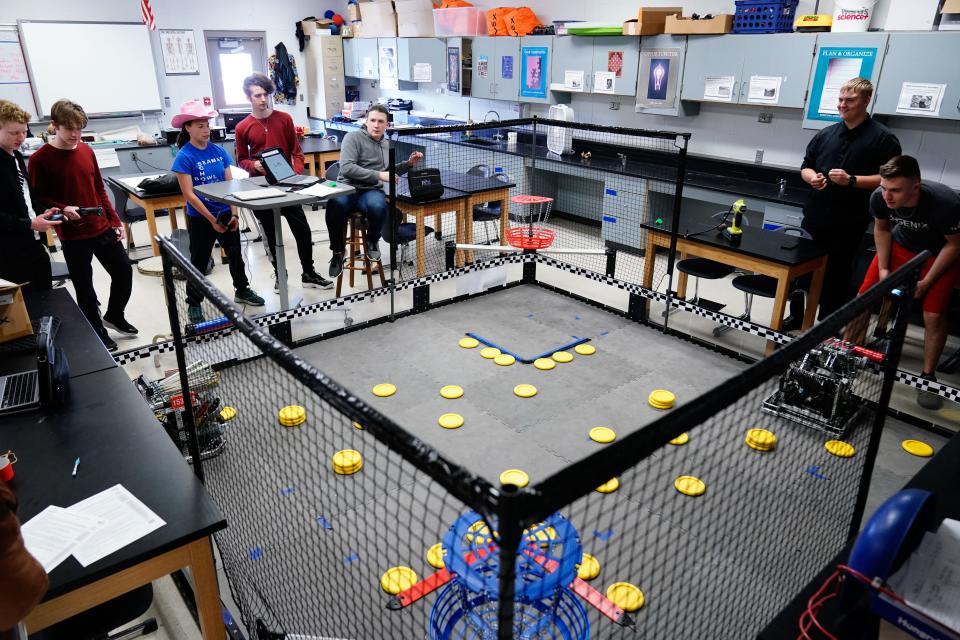 An arena within Seaman science teacher Chris Goble's classroom helps the robotics teams work through their designs and practice games like Spin Out Thursday afternoon. The teams will be heading to Texas this week to compete in the Vex World Robotics Championships.
