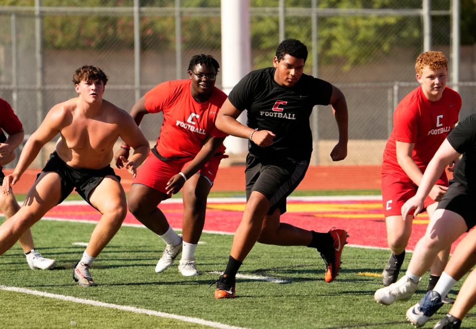 Chaparral football player Phoenix Jenkins (center right) during conditioning at Chaparral High in Scottsdale on July 13, 2023.