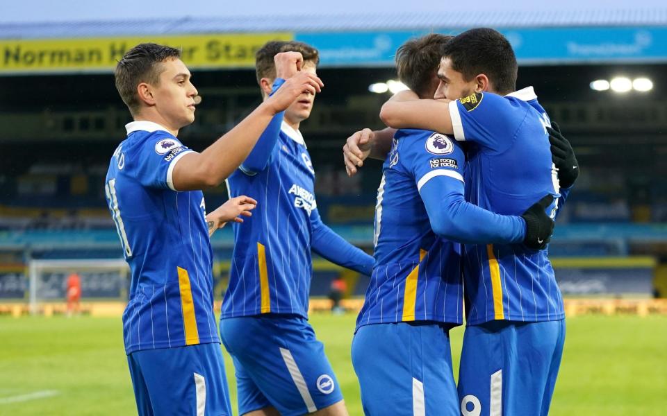 Neal Maupay of Brighton and Hove Albion celebrates with teammates after scoring his team's first goal during the Premier League match between Leeds United and Brighton & Hove Albion at Elland Road on January 16, 2021 in Leeds, England. - GETTY IMAGES