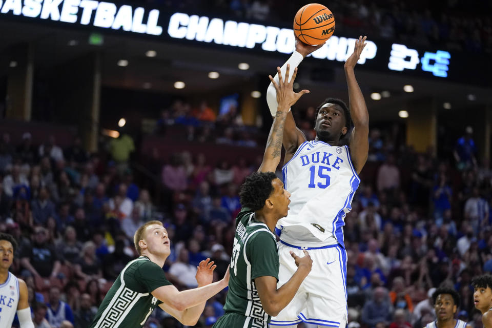 FILE - Duke center Mark Williams shoots over Michigan State forward Marcus Bingham Jr. during the first half of an NCAA college basketball game in the second round of the NCAA tournament on Sunday, March 20, 2022, in Greenville, S.C. Williams is one of the top big men in this year's NBA draft. (AP Photo/Chris Carlson, File)