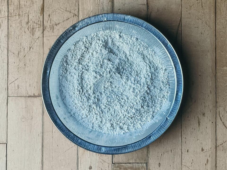 bowl of flour on a wooden surface