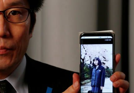 Takuya Yokota shows a picture of his sister Megumi Yokota, a Japanese national abducted by North Korean agents decades ago as a schoolgirl, on his smartphone during an interview with Reuters in Tokyo, Japan October 26, 2017. Picture taken on October 26, 2017. REUTERS/Kim Kyung-Hoon