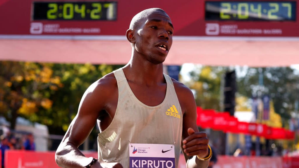  Kenya's Benson Kipruto reacts after crossing the finish line to place first in the men's division of the 2022 Bank of America Chicago Marathon in Chicago, Illinois, on October 9, 2022. 