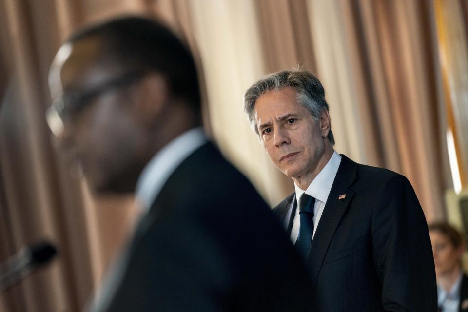 Secretary of State Antony Blinken listens as Rwanda's Minister of Foreign Affairs Vincent Biruta speaks during a news conference at the Ministry of Foreign Affairs and International Cooperation in Kigali, Rwanda, Thursday, Aug. 11, 2022. Blinken is on a ten day trip to Cambodia, Philippines, South Africa, Congo, and Rwanda. (AP Photo/Andrew Harnik, Pool)