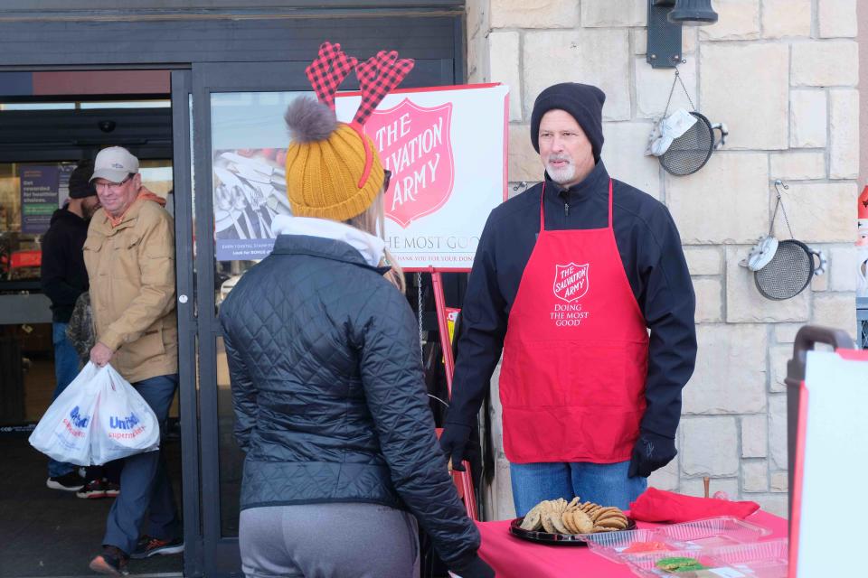 A bell ringer for the Salvation Army spreads the word Saturday at United Supermarkets in southwest Amarillo.