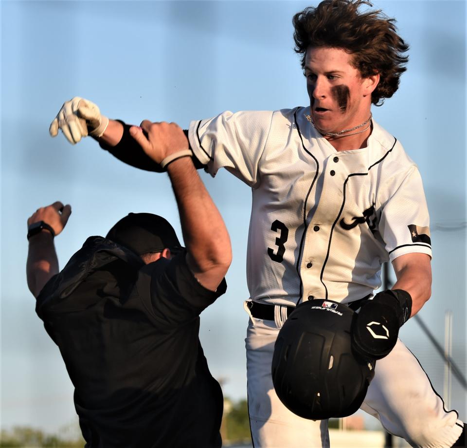 Abilene High's Brady Bennett celebrates after scoring when Jake Breckenridge reached on a two-out, two-run error in the first inning against Wylie.