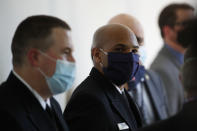 Surgeon General Jerome Adams waits for President Donald Trump to arrive to speaks about the coronavirus in the Rose Garden of the White House, Friday, May 15, 2020, in Washington. (AP Photo/Alex Brandon)