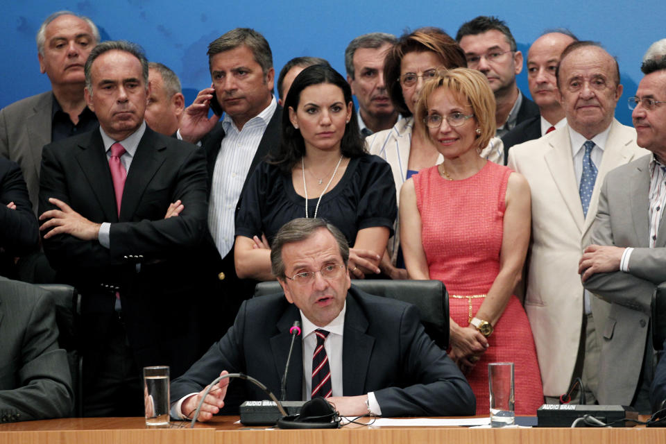 Leader of the New Democracy conservative party Antonis Samaras, center, speaks during a press conference in Athens, Sunday, June 17, 2012. The pro-bailout New Democracy party came in first Sunday in Greece's national election, and its leader has proposed forming a pro-euro coalition government.(AP Photo/Petros Giannakouris)