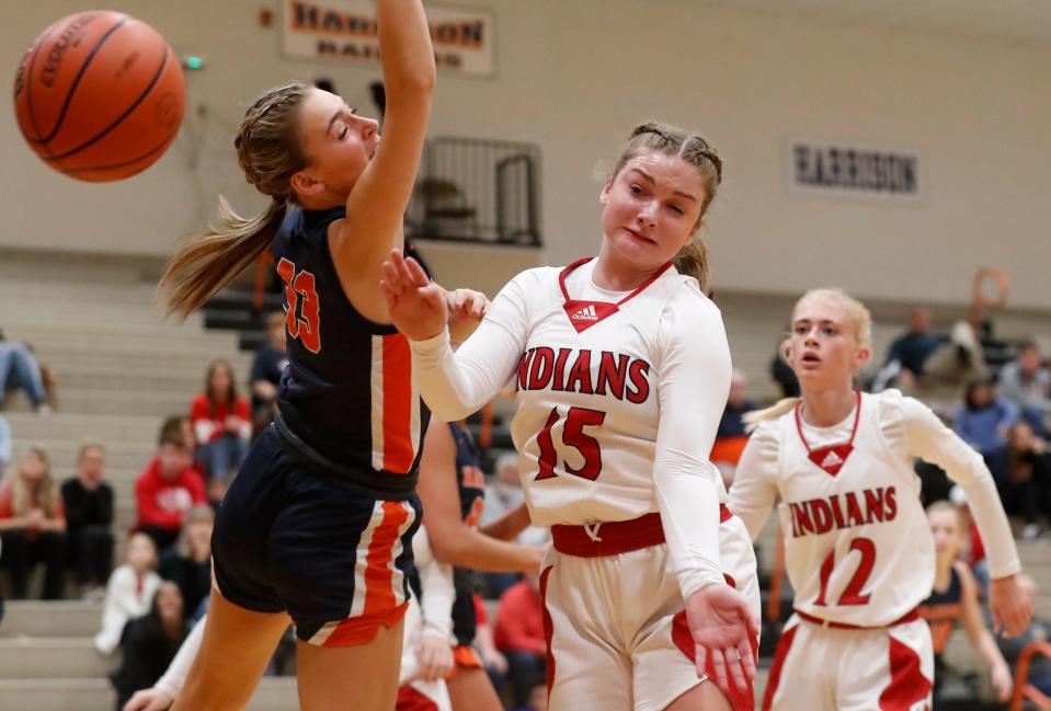 Harrison Raiders Kiersten Guyer (33) and Twin Lakes guard Olivia Nickerson (15) fight for a rebound during the IU Health Hoops Classic girl’s basketball fifth place game, Saturday, Nov. 18, 2023, at Harrison High School in West Lafayette, Ind. Twin Lakes won 61-42.