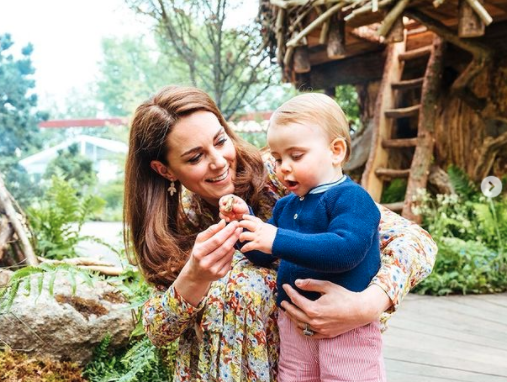 Kate with Prince Louis at flower shower photo in frame of living room