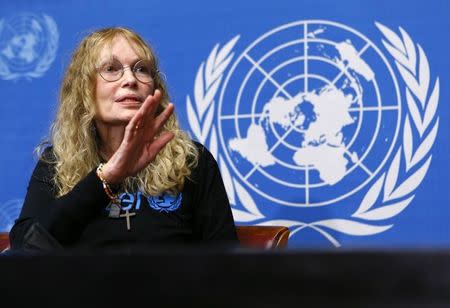 U.S. actress and UNICEF Goodwill ambassador Mia Farrow gestures during a news conference at the United Nations European headquarters in Geneva November 14, 2013.REUTERS/Denis Balibouse