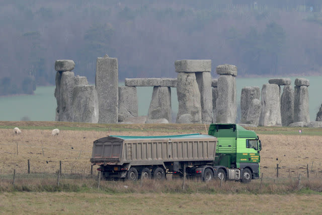 Traffic passes Stonehenge on the A303 road in Wiltshire, as Highways England is holding a public consultation on its plans for putting the A303 into a 1.8-mile (2.9km) dual carriageway tunnel where it passes the ancient stone circle to cut congestion and improve the surroundings.