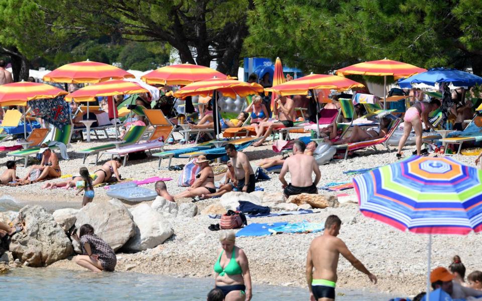 Sunbathers in Croatia - DENIS LOVROVIC/AFP via Getty Images