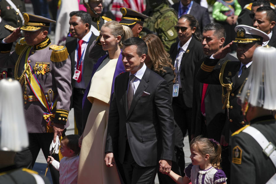 Ecuador's President-elect Daniel Noboa arrives with his wife Lavinia Valbonesi and two children, to the National Assembly to be sworn in as the new president, in Quito, Ecuador, Thursday, Nov. 23, 2023. (AP Photo/Carlos Noriega)