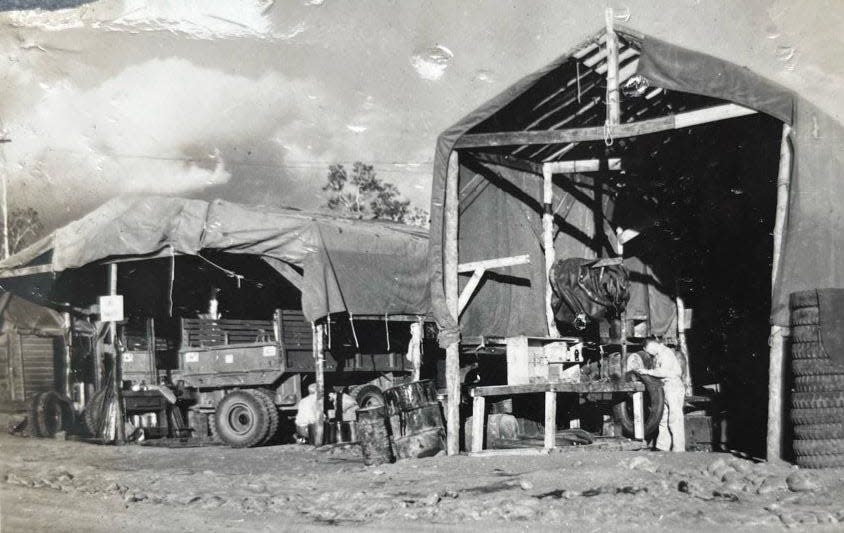 A photo showing what appears to be a military base repair shop on New Caledonia in the South Pacific.