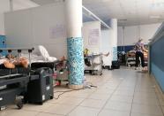 COVID-19 patients receive treatment at Charles Nicole Hospital in Tunis