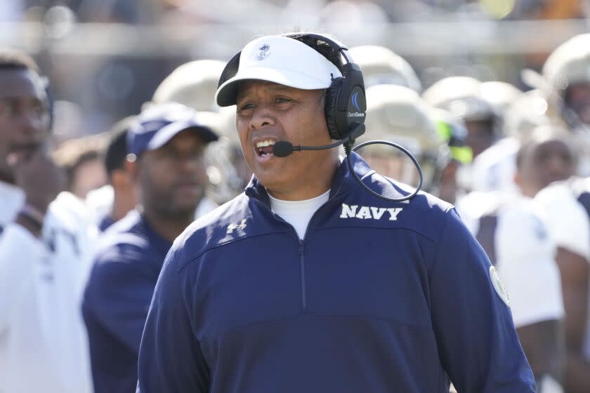 Navy head coach Ken Niumatalolo yells to an official during the first half of an NCAA college football game against Central Florida, Saturday, Nov. 19, 2022, in Orlando, Fla. (AP Photo/John Raoux)