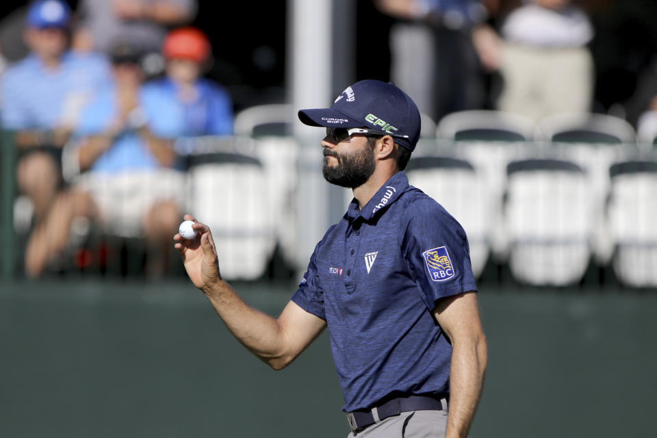 Adam Hadwin acknowledges the crowd moments after making a birdie at 17 while playing in the second round of the Valspar Golf Championship at Innisbrook Resort and Golf Club's Copperhead Course on Friday, March 10, 2017, in Palm Harbor, Fla. (Douglas R. Clifford/The Tampa Bay Times via AP)