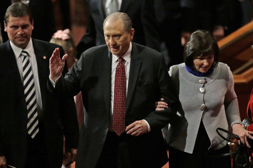 Thomas S. Monson, president of the Church of Jesus Christ of Latter-day Saints, walks with his daughter, Ann M. Dibb, right, following the morning session Saturday, April 5, 2014, in Salt Lake City. More than 100,000 Latter-day Saints are expected in Salt Lake City this weekend for the church's biannual general conference. Leaders of The Church of Jesus Christ of Latter-day Saints give carefully crafted speeches aimed at providing members with guidance and inspiration in five sessions that span Saturday and Sunday. They also make announcements about church statistics, new temples or initiatives. In addition to those filling up the 21,000-seat conference center during the sessions, thousands more listen or watch around the world in 95 languages on television, radio, satellite and Internet broadcasts. (AP Photo/Rick Bowmer)