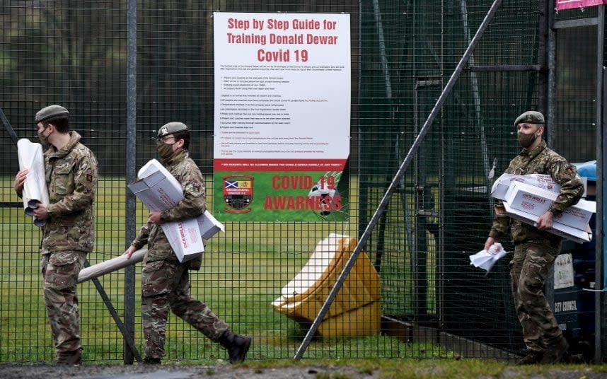 Members of the Royal Scots Dragoon Guard set up a Covid vaccination centre in Glasgow - Jeff J Mitchell /Getty