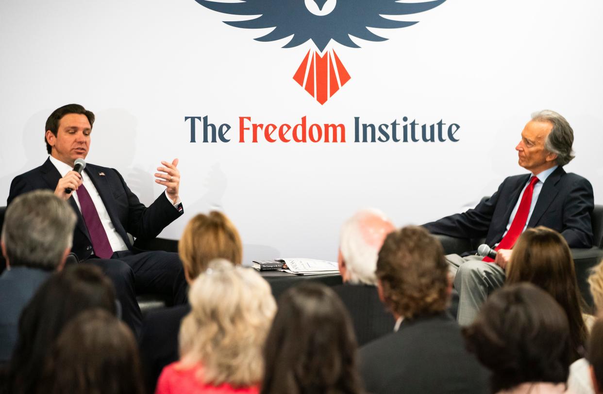 Gov. Ron DeSantis, left, speaks with Tom Grady at The Freedom Institute of Collier County in Naples on Wednesday, Feb. 28, 2024.