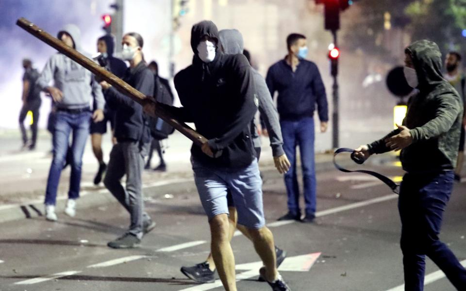 Protesters in action during clashes with police outside the Serbian Parliament in Belgrade on Tuesday  - KOCA SULEJMANOVIC/EPA-EFE/Shutterstock/Shutterstock 