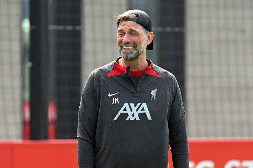 Jürgen Klopp smiles during his final training session at Liverpool.