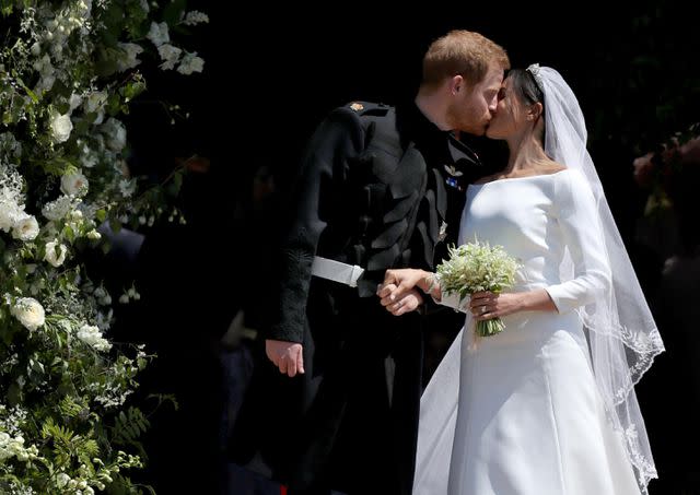 <p>Jane Barlow - WPA Pool/Getty</p> Prince Harry and Meghan Markle kiss after their wedding on May 19, 2018