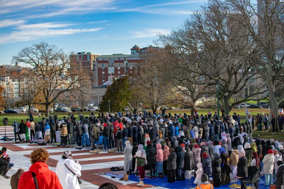 Muslims pray on tarps laid out in front of the Rhode Island State House on Friday before marching on Providence Place in a pro-Palestine protest.