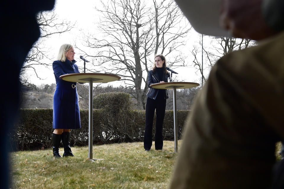 Swedish Prime Minister Magdalena Andersson, left, and Finnish Prime Minister Sanna Marin give a press conference ahead of a meeting on whether to seek NATO membership, in Stockholm, Sweden, Wednesday, April 13, 2022. (Paul Wennerholm/TT via AP)