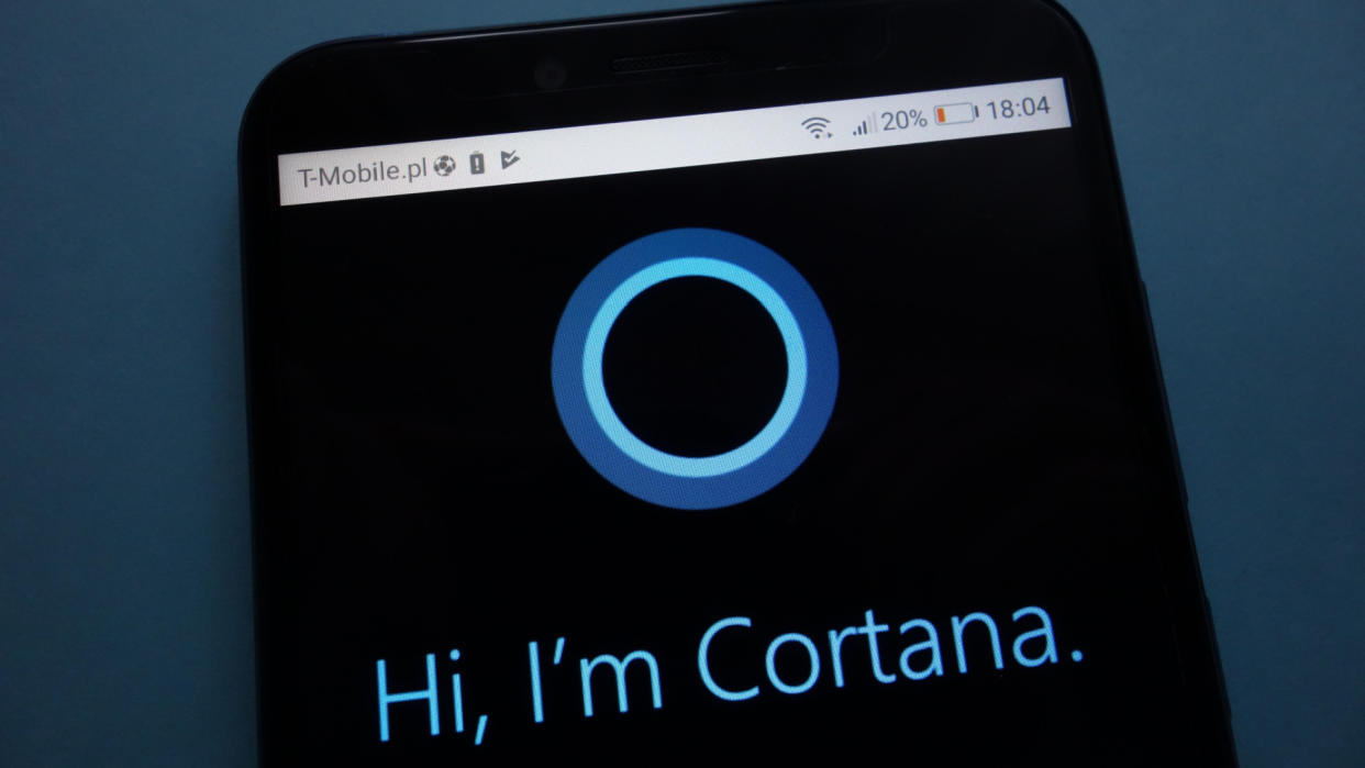  a phone with the words "Hi I'm Cortana" on the screen 