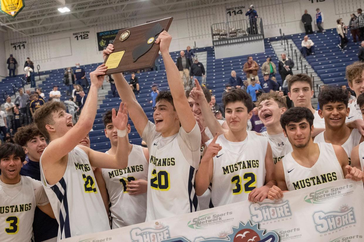 Marlboro celebrate their victory. Marlboro Boys Basketball defeats Manasquan 63-46 in Shore Conference Finals in Toms River on February 27, 2022. 