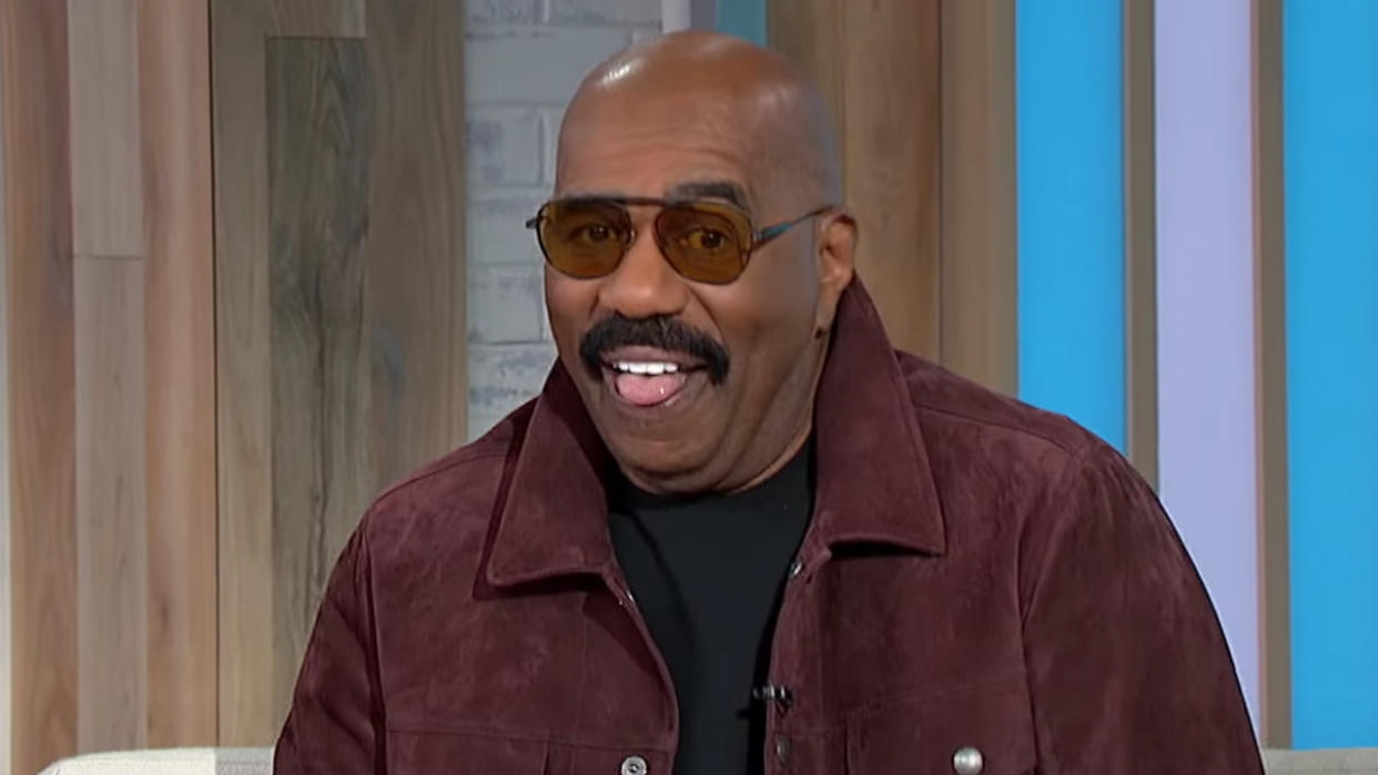  Steve Harvey with tongue out on Sherri. 