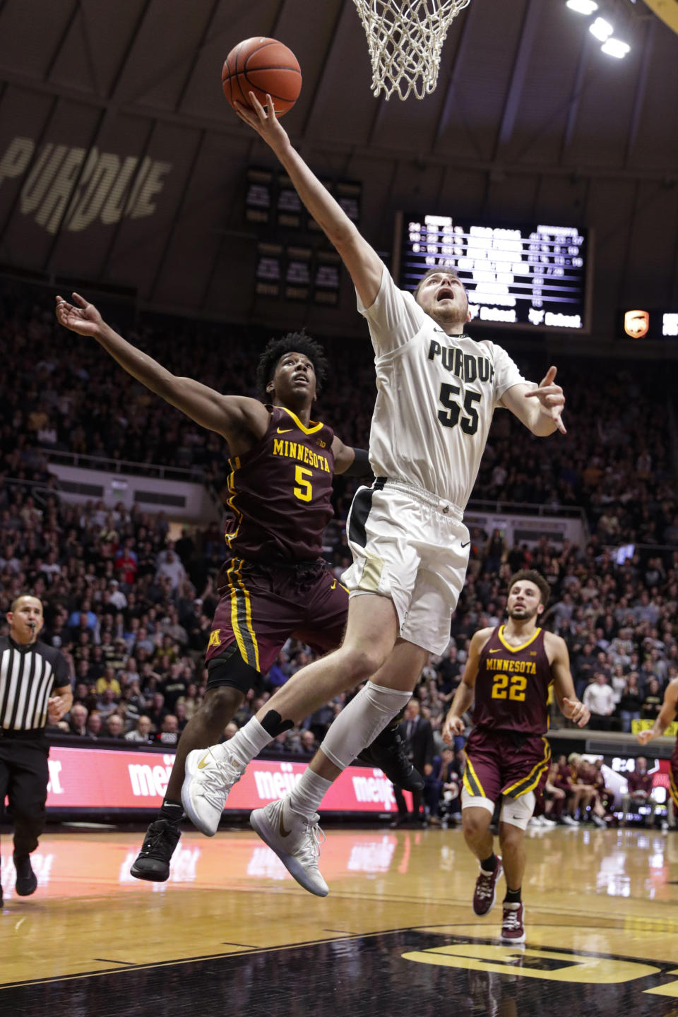 Purdue guard Sasha Stefanovic (55) shoots in front of Minnesota guard Marcus Carr (5) during the second half of an NCAA college basketball game in West Lafayette, Ind., Thursday, Jan. 2, 2020. Purdue won 83-78 in double overtime. (AP Photo/Michael Conroy)