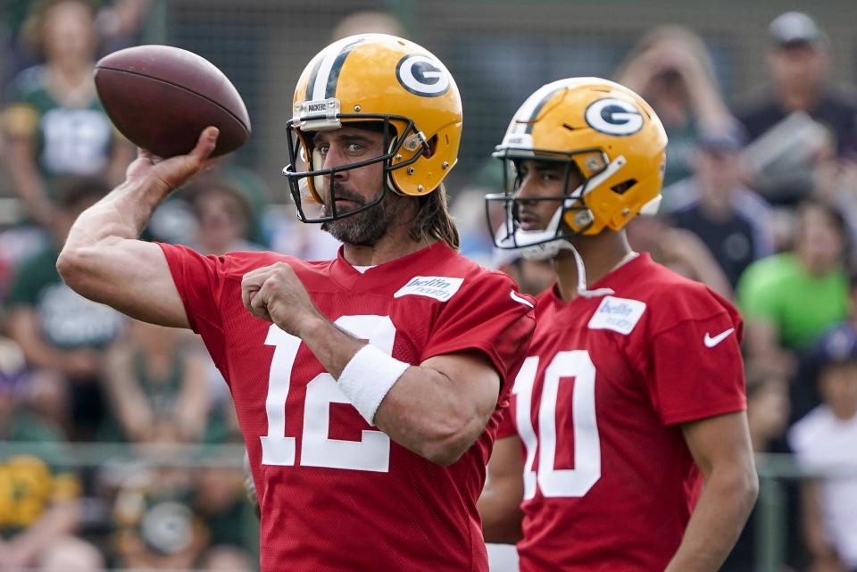 Green Bay Packers' Aaron Rodgers runs a drill at the NFL football team's practice field Wednesday, July 27, 2022, in Green Bay, Wis. (AP Photo/Morry Gash)