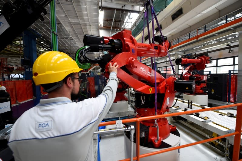 FILE PHOTO: Ceremony to mark the installation of the first robot on the production line for the new electric Fiat 500 BEV at the Mirafiori industrial complex on the 80th birthday of the plant